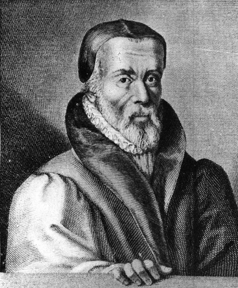 Engraved portrait of William Tyndale, an older bearded man in a dark scholar's gown with a white ruffled collar, one hand resting on a ledge.